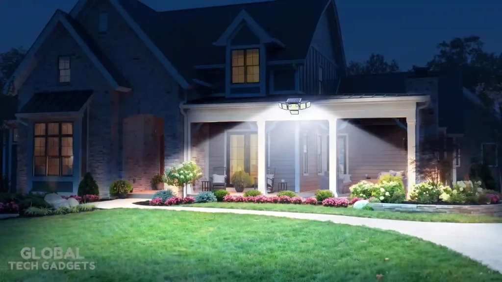 The 10 Best Outdoor Solar Lights 10 A small Omibee 4-Head Solar Motion Sensor Light mounted under the eaves of a large, traditional American-style house, brilliantly illuminating the garden and front pathway at evening